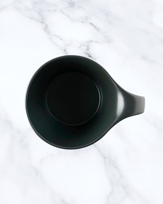 The Stamug is a porcelain mug with a compact 250ml capacity. Finished in an even matt black glaze.