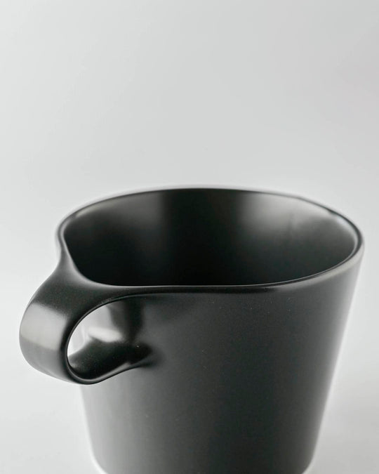 The Stamug is a porcelain mug with a compact 250ml capacity. Finished in an even matt black glaze.