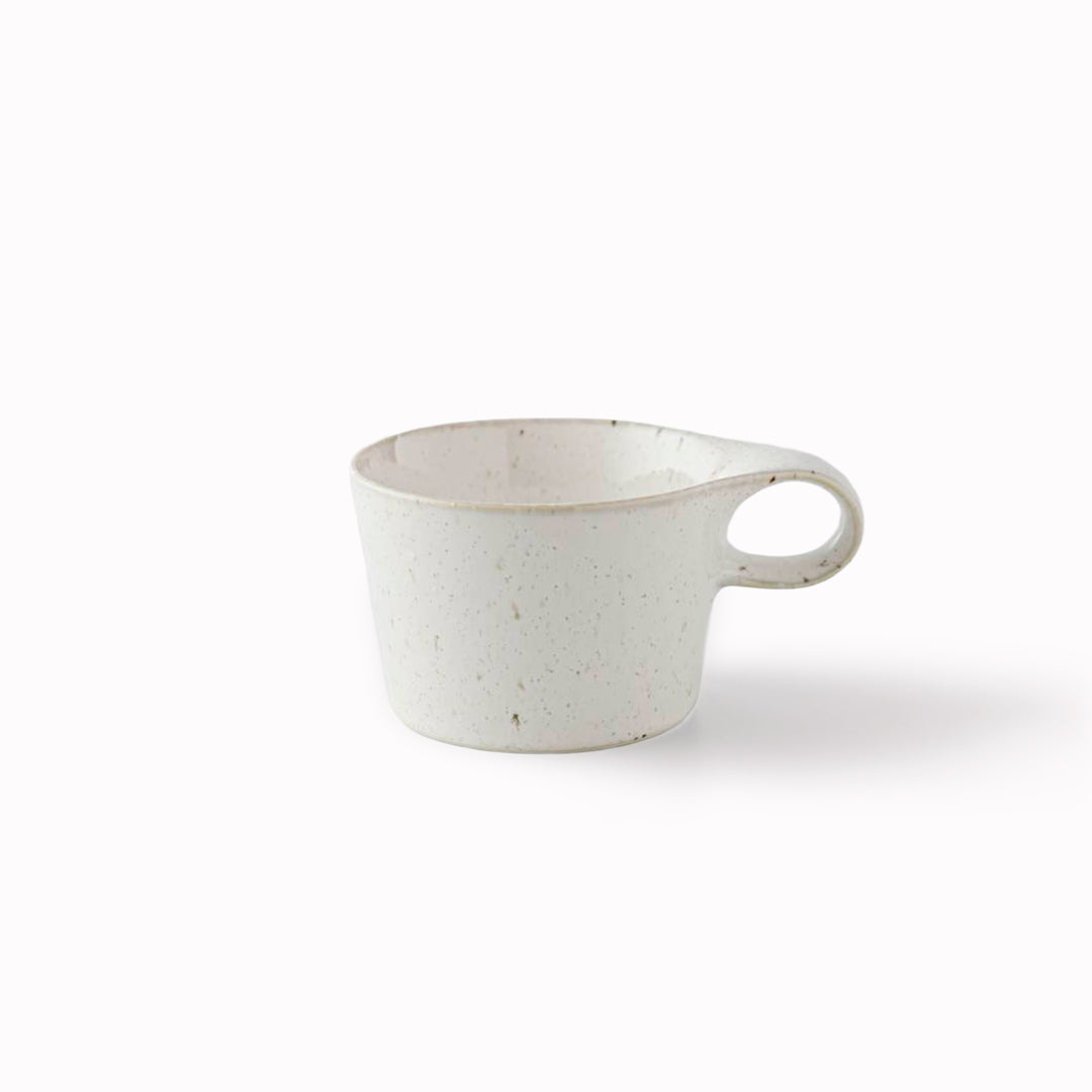 The Stamug is a porcelain mug with 150ml capacity for tea or shorter coffee drinks. Finished in a white kiln gloss glaze with a soft slightly speckled finish.