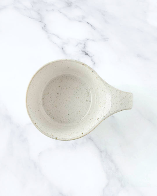 The Stamug is a porcelain mug with 150ml capacity for tea or shorter coffee drinks. Finished in a white kiln gloss glaze with a soft slightly speckled finish.