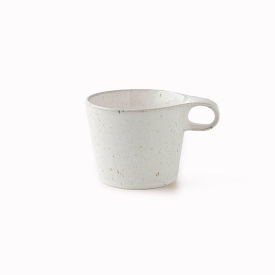 The Stamug is a porcelain mug with a compact 250ml capacity, finished in a white kiln gloss glaze with a soft slightly speckled finish.