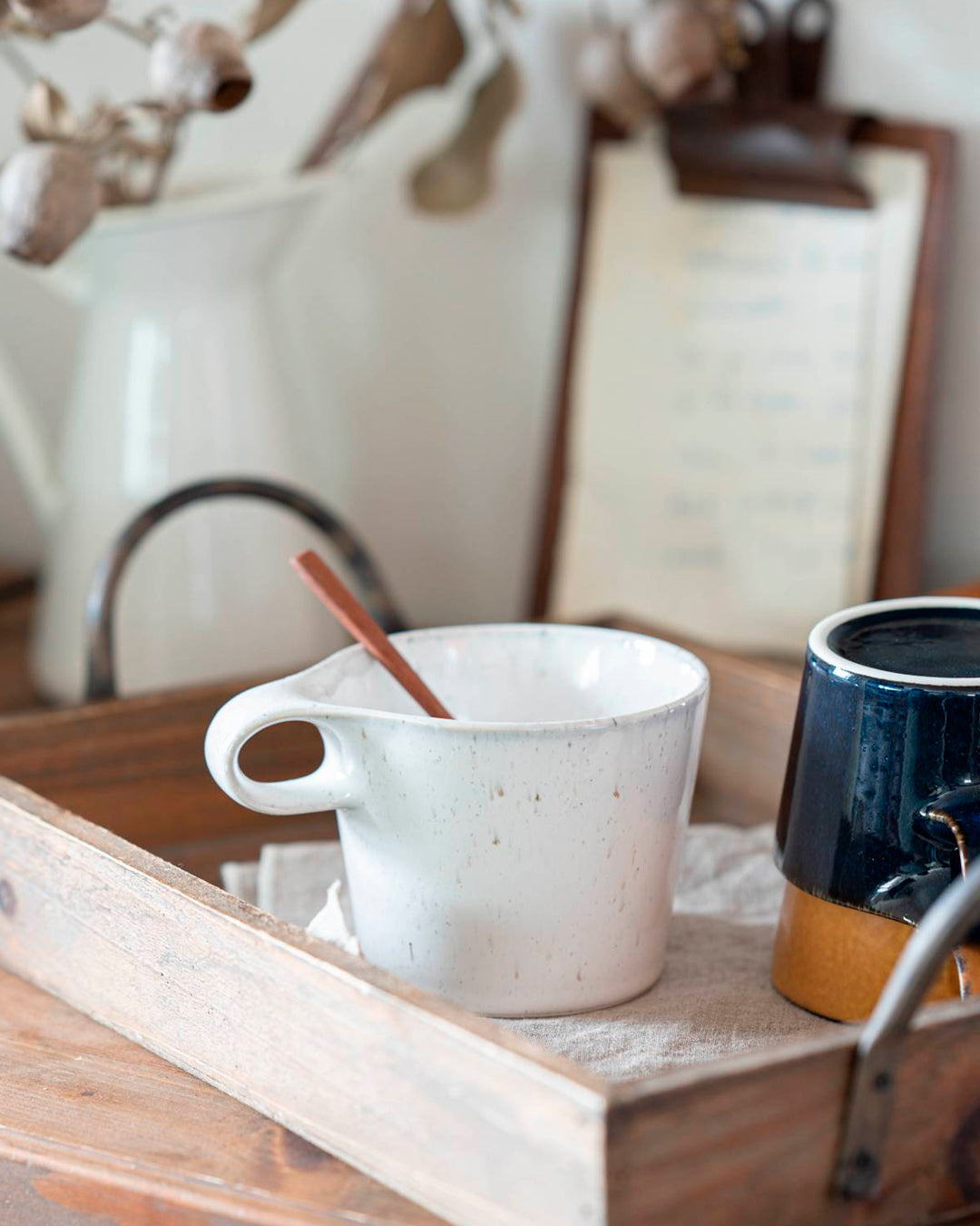 The Stamug is a porcelain mug with a compact 250ml capacity, finished in a white kiln gloss glaze with a soft slightly speckled finish.