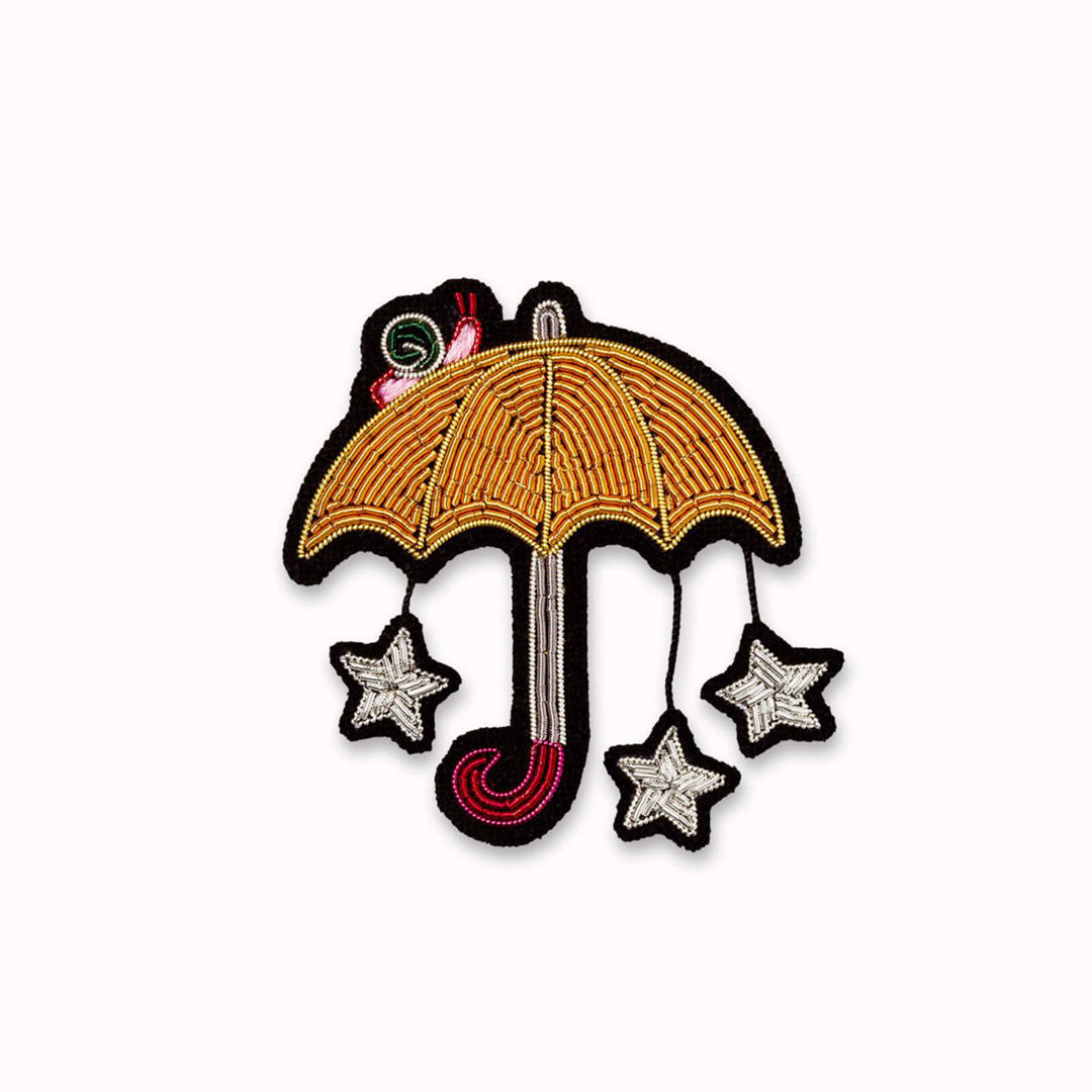 Hand embroidered Starry Umbrella decorative lapel pin by Paris based Macon et Lesquoy - personalise your favourite garments to define your individual style.  
