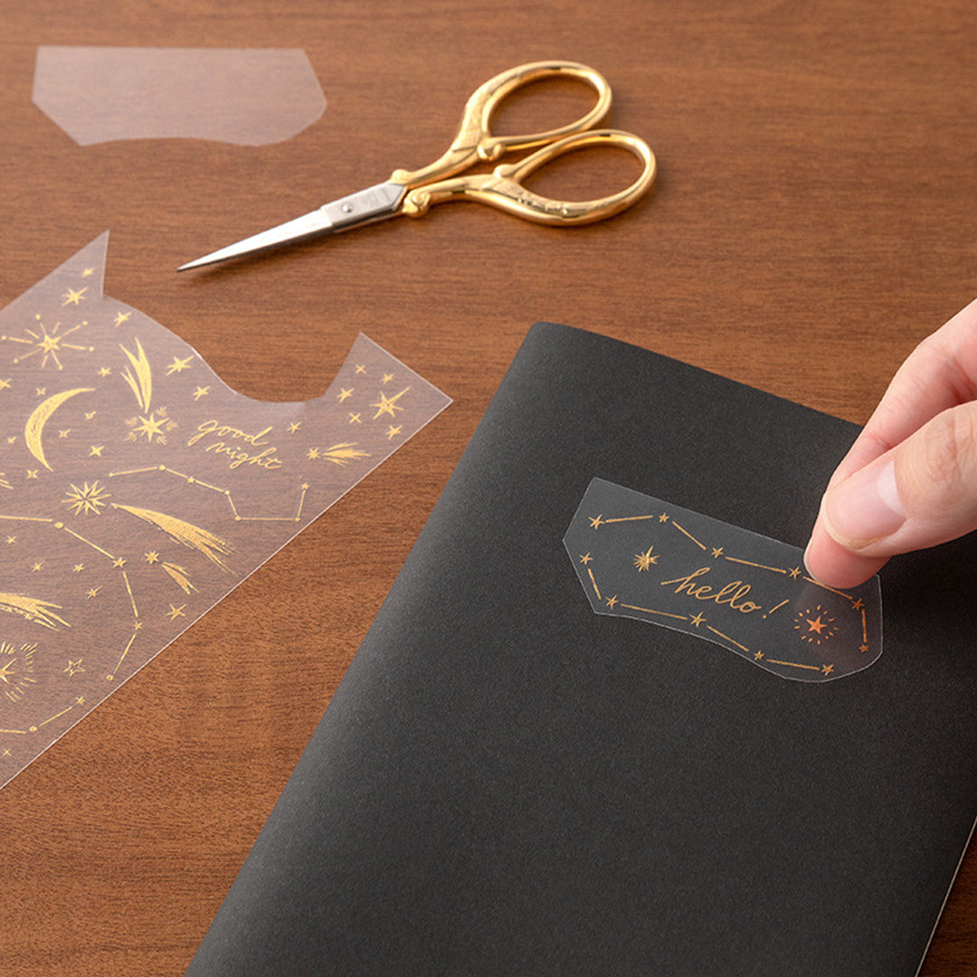 Add some shine to your journalling with Midori's foil transfer stickers. The designs are printed in gold foil with a super sticky adhesive back. You transfer them to your notebook by lightly rubbing the design against the paper and they look like they have been authentically foil stamped