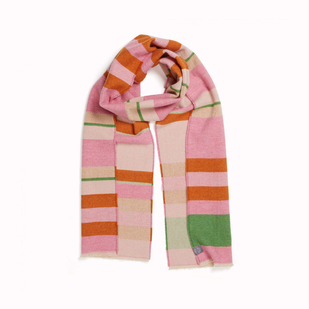 The Stölzl Lambswool Scarf from Wallace and Sewell showcases the design of Gunta Stölzl’s original ‘Prellerdecke’ blanket. The Nougat colour scheme displays a mid tone design that is warm, its pinks and ochre hue influenced by Paul Klee's painting 'Senecio'.