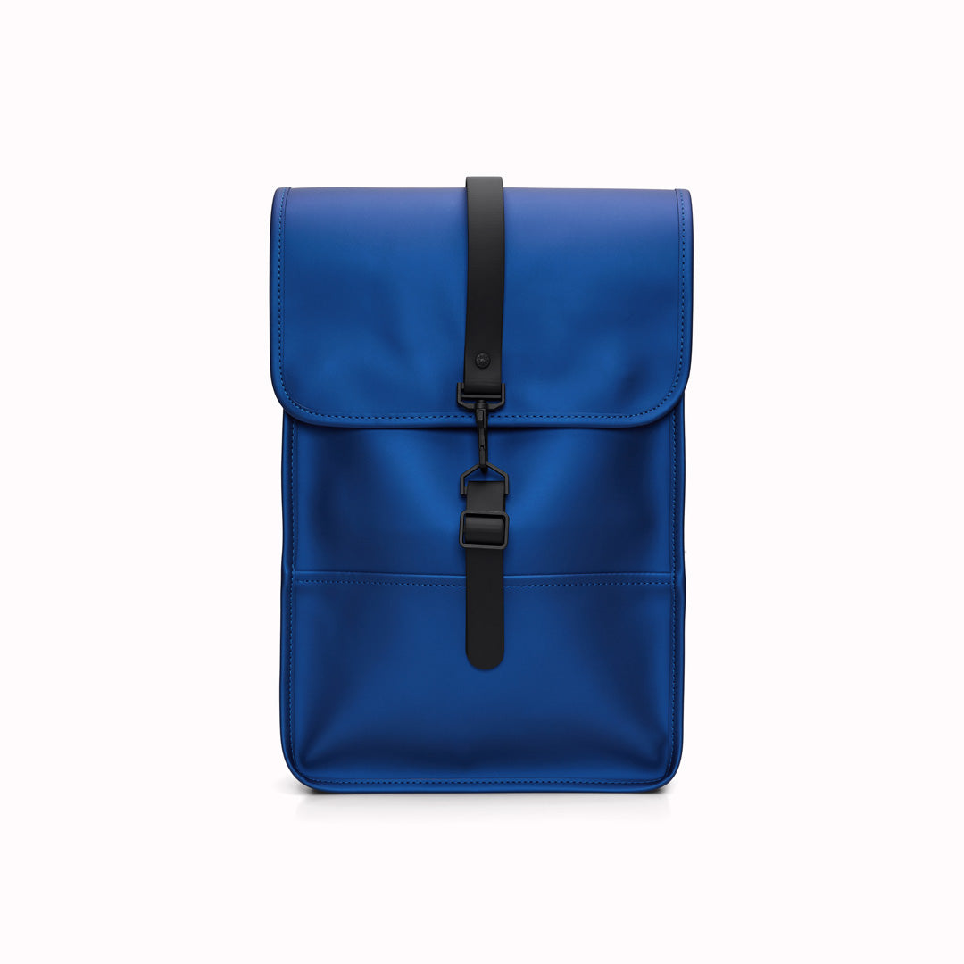 Storm Blue Mini Backpack from the Rains SS24 colour palette. Made from Rains' signature water-resistant fabric with a matte finish, this minimalistic, modern rucksack is called 'Mini' but is the perfect size for daily use.