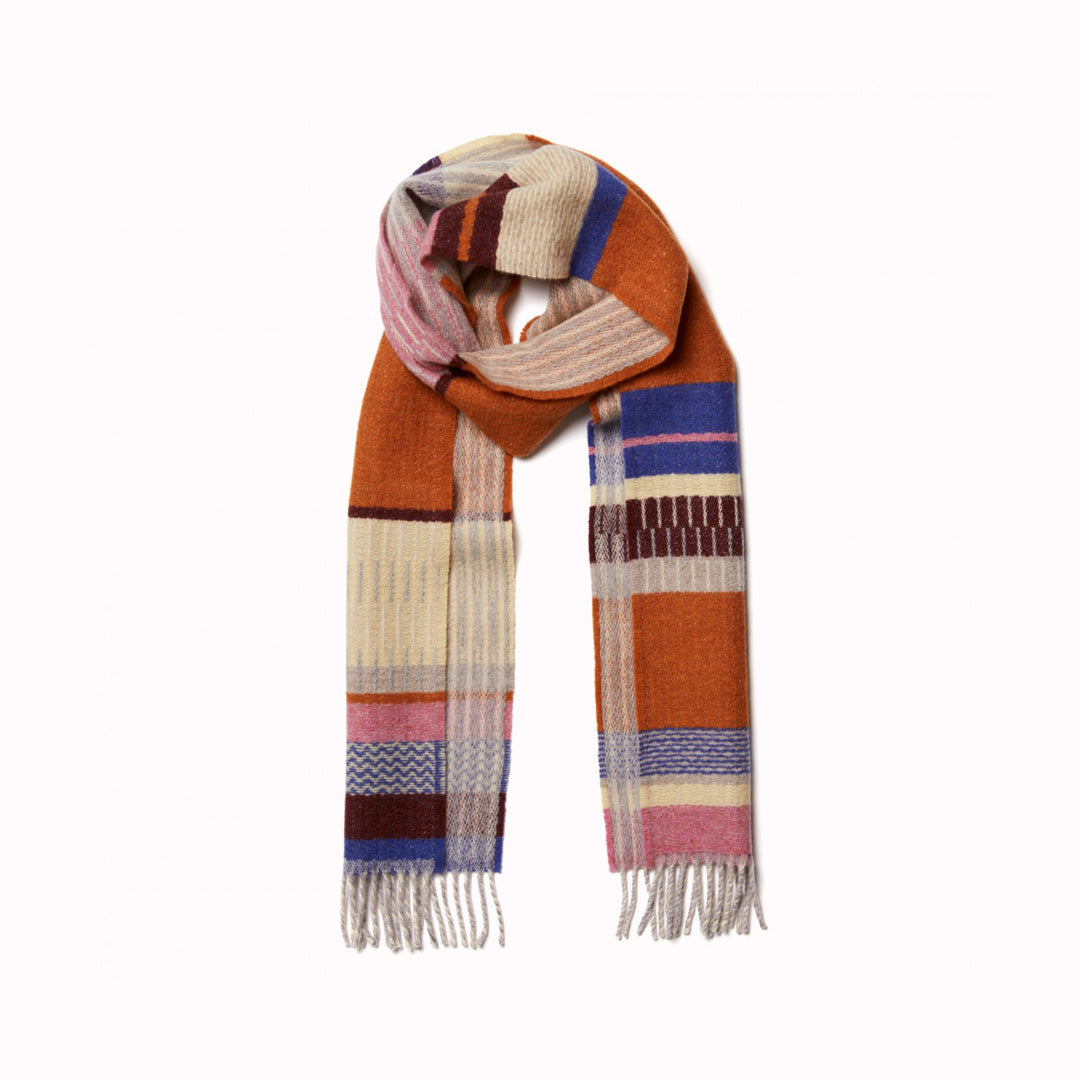 The Strathay Amber Lambswool scarf by Wallace and Sewell is a 100% Merino Lambswool scarf in a colourful pattern of Ambers, Bubblegum Pink and Buttercup Yellow.