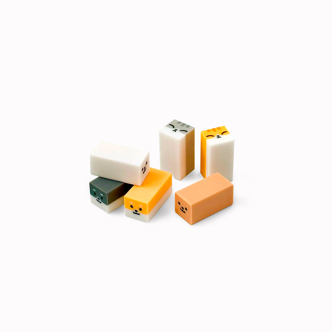 A small-format eraser that starts as a clean block and gradually reveals a rounded dog or cat character as it wears down. Each piece is blind-packed, so you will not know which you are getting.