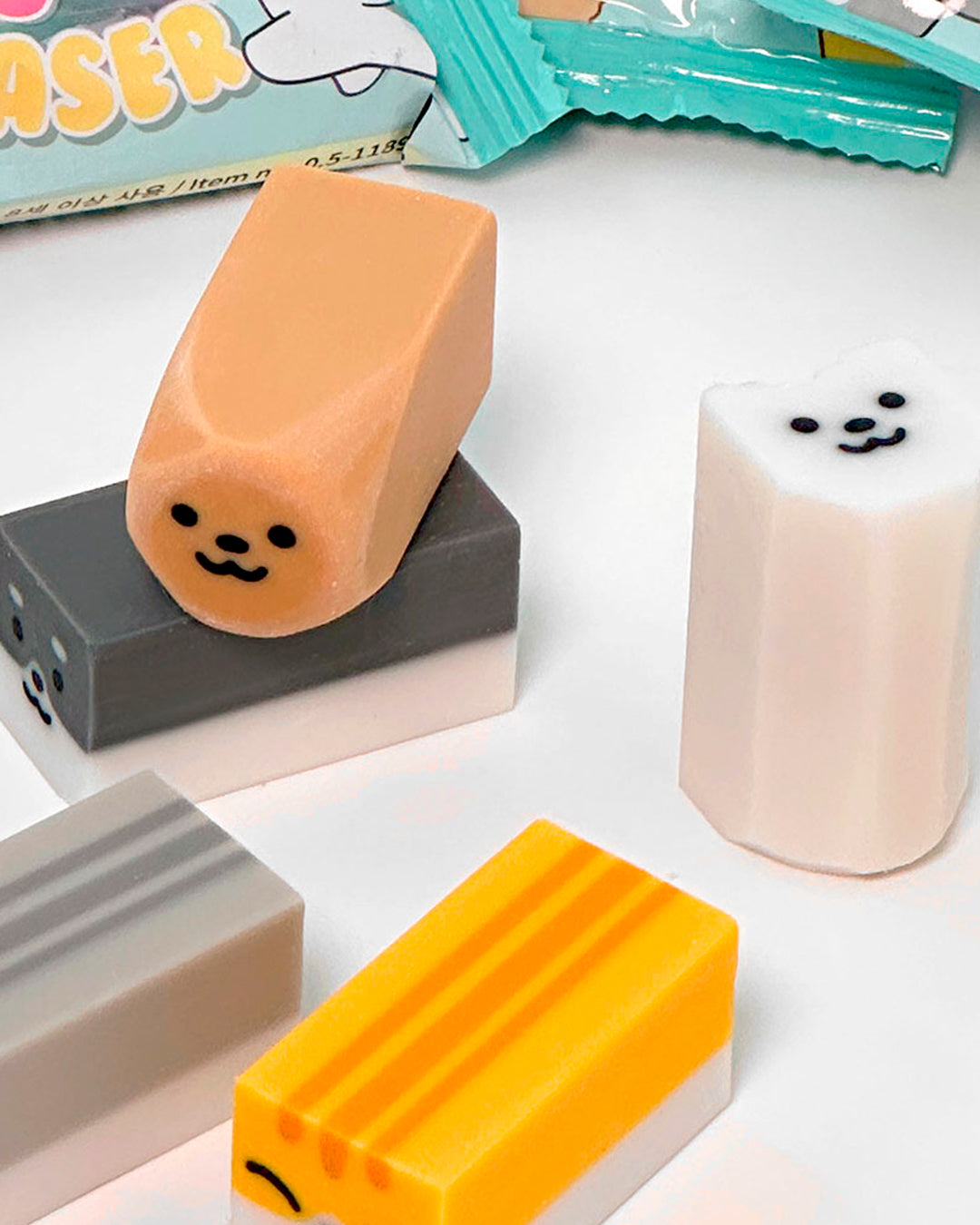 A small-format eraser that starts as a clean block and gradually reveals a rounded dog or cat character as it wears down. Each piece is blind-packed, so you will not know which you are getting.