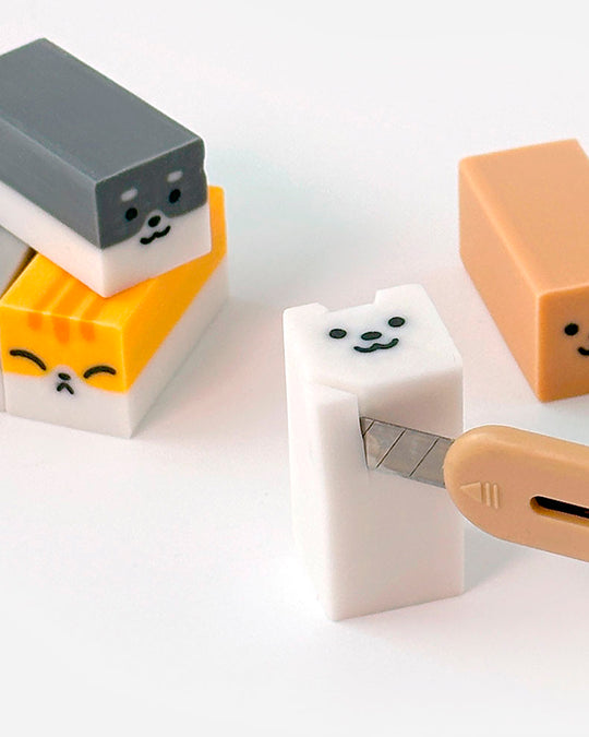 A small-format eraser that starts as a clean block and gradually reveals a rounded dog or cat character as it wears down. Each piece is blind-packed, so you will not know which you are getting.