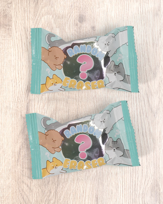 A small-format eraser that starts as a clean block and gradually reveals a rounded dog or cat character as it wears down. Each piece is blind-packed, so you will not know which you are getting.