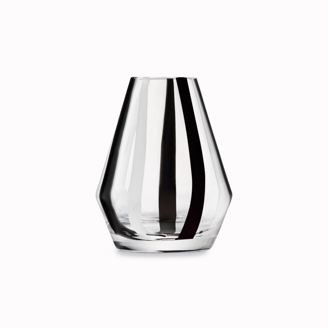 A bold and graphic black and white striped glass vase by LSA International. With hand applied stripes, each piece has slight variations which add to the artisan appeal of these mouth blown glass vases.