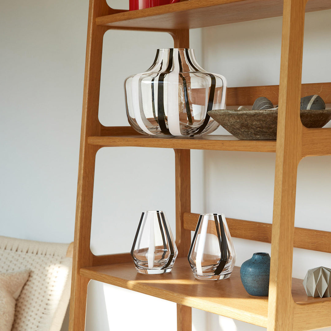 A bold and graphic black and white striped glass vase by LSA International. With hand applied stripes, each piece has slight variations which add to the artisan appeal of these mouth blown glass vases.