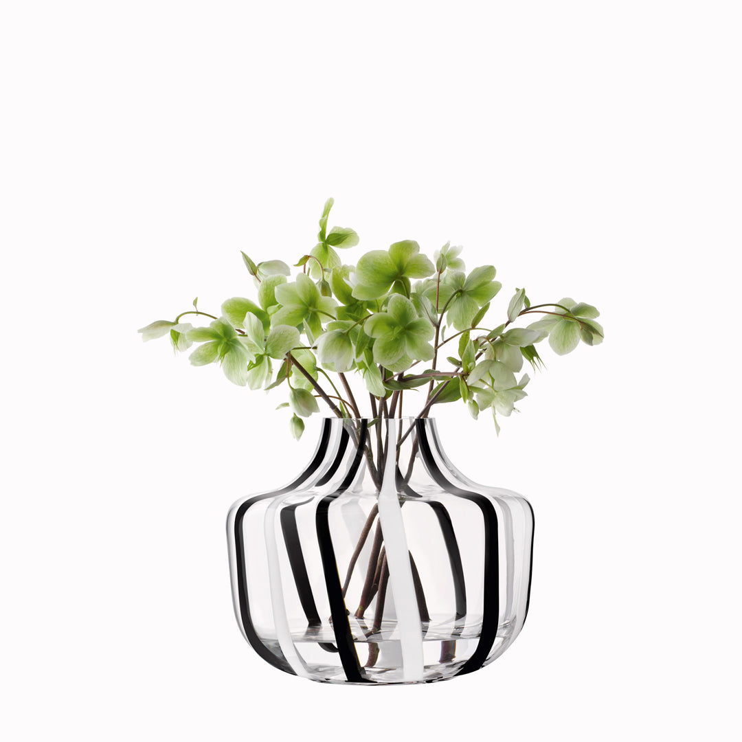 A show stopping bold and graphic black and white striped glass vase by LSA International. With hand applied stripes, each piece has slight variations which add to the artisan appeal of these mouth blown glass vases.&nbsp;