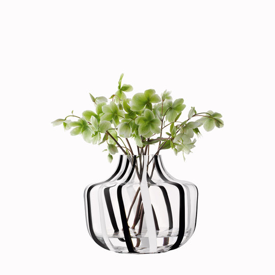 A show stopping bold and graphic black and white striped glass vase by LSA International. With hand applied stripes, each piece has slight variations which add to the artisan appeal of these mouth blown glass vases.&nbsp;