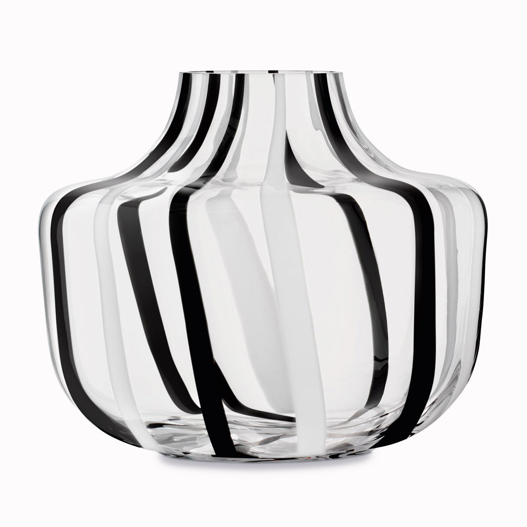 A show stopping bold and graphic black and white striped glass vase by LSA International. With hand applied stripes, each piece has slight variations which add to the artisan appeal of these mouth blown glass vases.&nbsp;