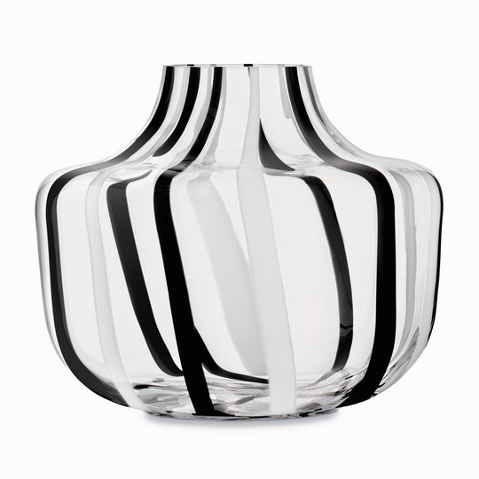 A show stopping bold and graphic black and white striped glass vase by LSA International. With hand applied stripes, each piece has slight variations which add to the artisan appeal of these mouth blown glass vases.&nbsp;