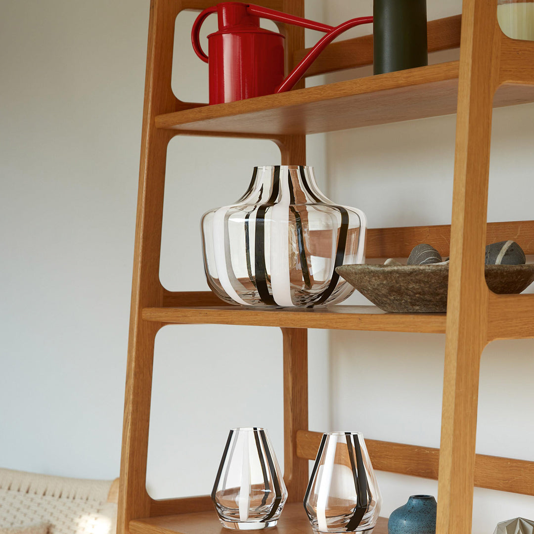 A show stopping bold and graphic black and white striped glass vase by LSA International. With hand applied stripes, each piece has slight variations which add to the artisan appeal of these mouth blown glass vases.&nbsp;