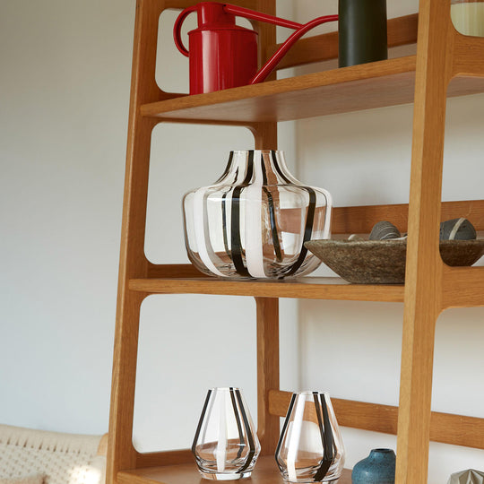 A show stopping bold and graphic black and white striped glass vase by LSA International. With hand applied stripes, each piece has slight variations which add to the artisan appeal of these mouth blown glass vases.&nbsp;