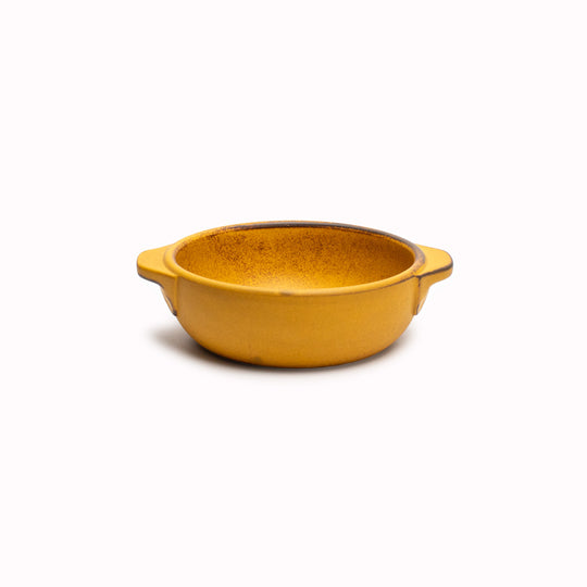 A hand finished Japanese contemporary over proof dish featuring handles and a sunflower yellow glaze.&nbsp;