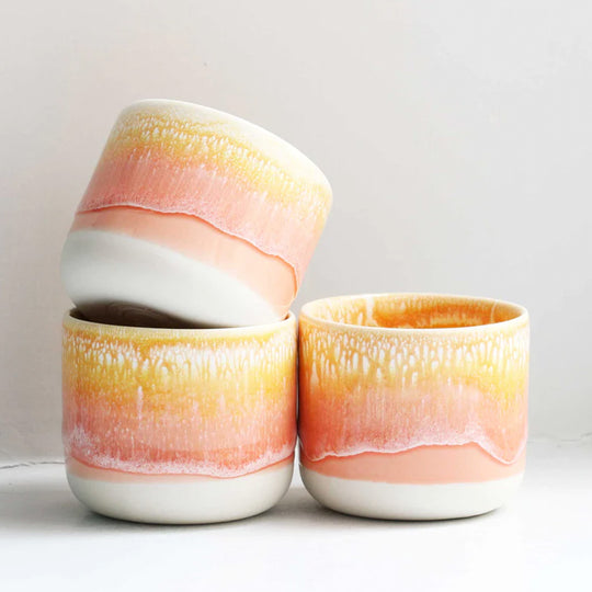 The strikingly yellow and orange Sip Cup, A Danish/Japanese mix up with this thick glazed, hand made ceramic small beaker from Studio Arhoj's Tokyo Series.