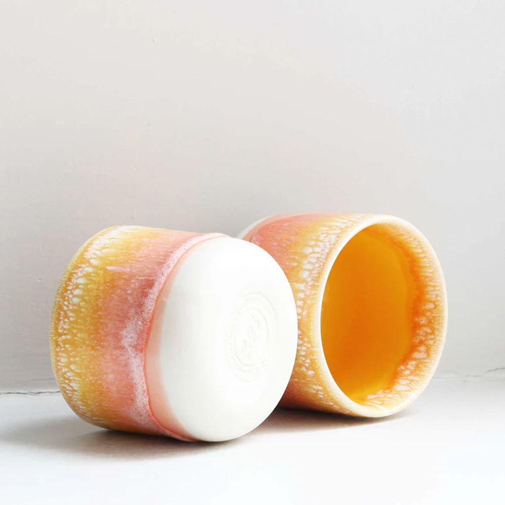 The strikingly yellow and orange Sip Cup, A Danish/Japanese mix up with this thick glazed, hand made ceramic small beaker from Studio Arhoj's Tokyo Series.