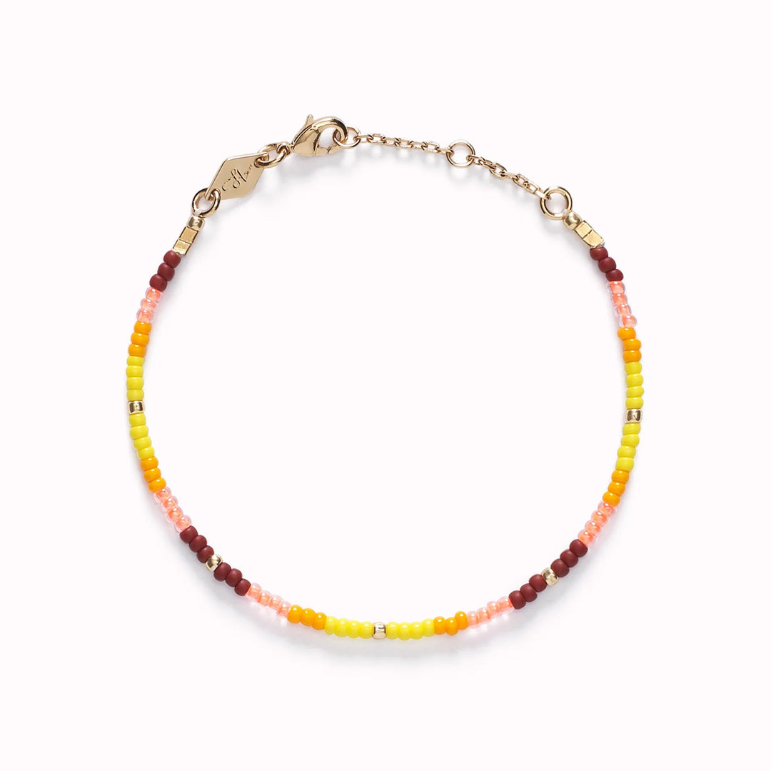 The Tie Dye Berry Necklace by Anni Lu is a vibrant and playful piece, crafted in brass with 18-Carat gold plating and anti-tarnish e-coating