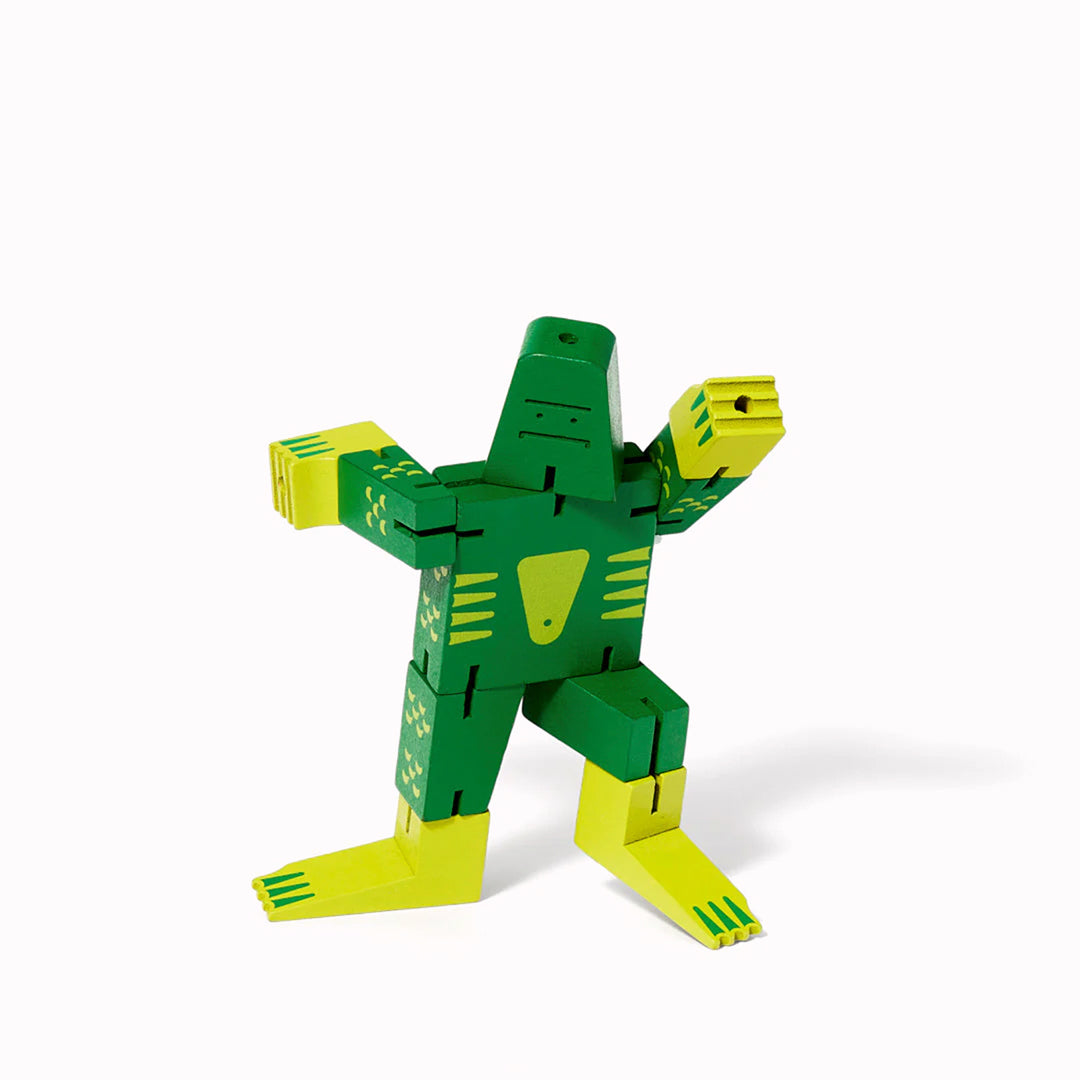 The Cubebot Cryptoids Swamp Creature is a wooden puzzle toy designed by David Weeks. This collectible item is constructed from durable beechwood and elastic