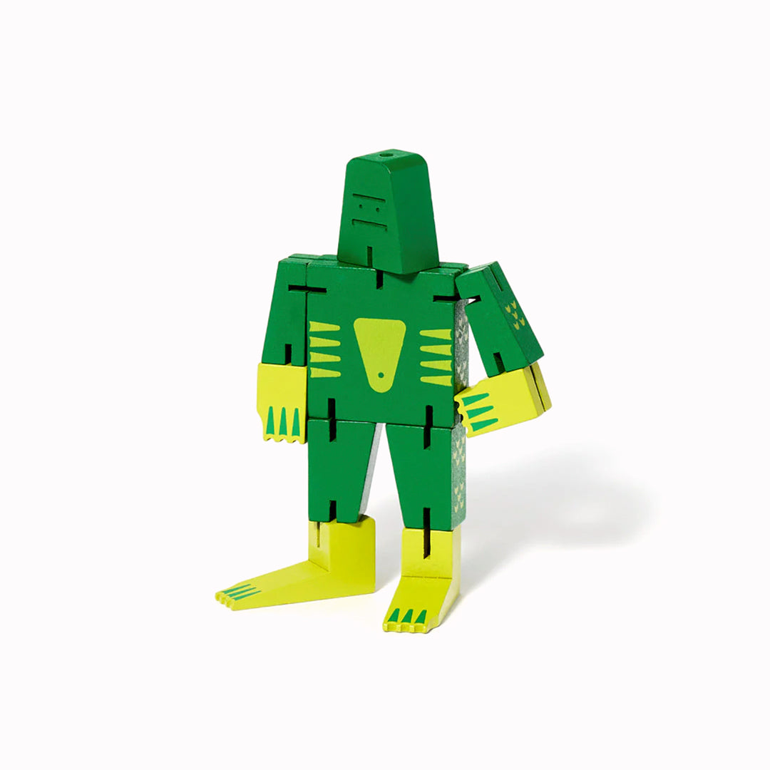 The Cubebot Cryptoids Swamp Creature is a wooden puzzle toy designed by David Weeks. This collectible item is constructed from durable beechwood and elastic