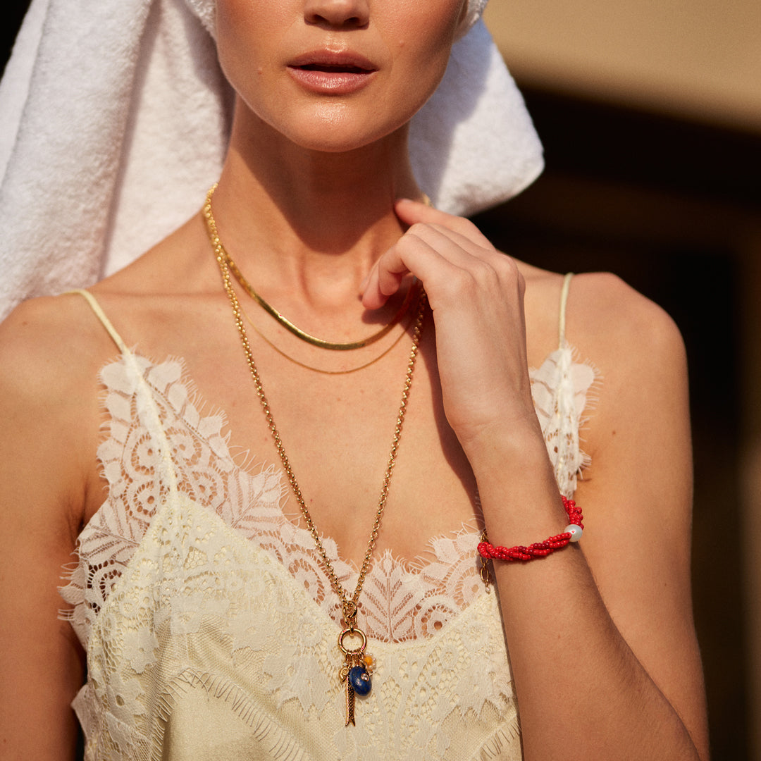 SWIMCLUB is a poolside daydream — pearls, lapis and golden details woven into playful elegance.