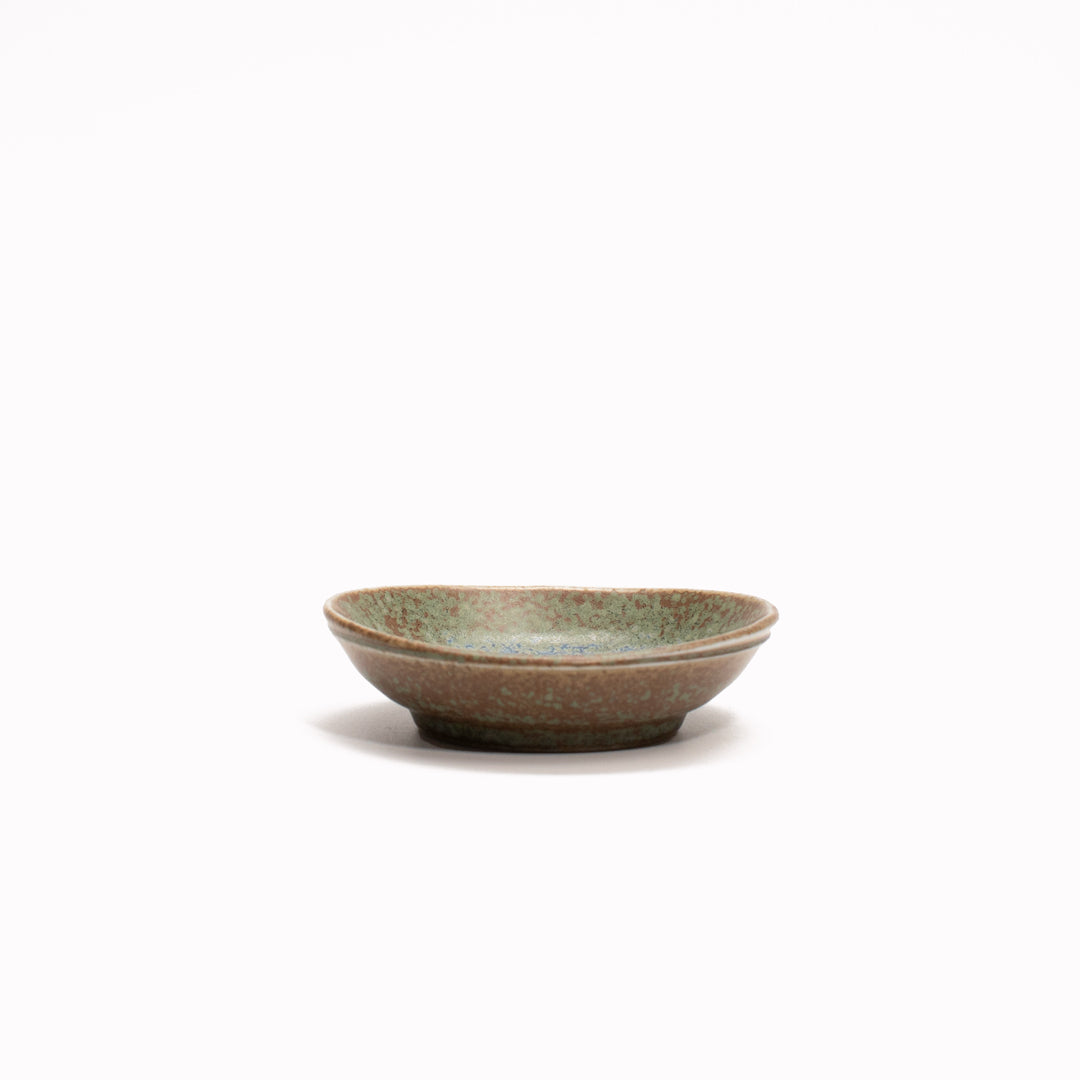 Table Sauce Dish from Made in Japan, approximately 8cm wide in a rustic green glaze - perfect for dipping sauces.  Side View