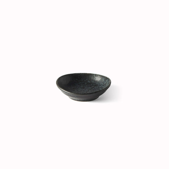 Made in Japan's BB Black porcelain collection features a mottled black glaze with iridescent blue highlights.