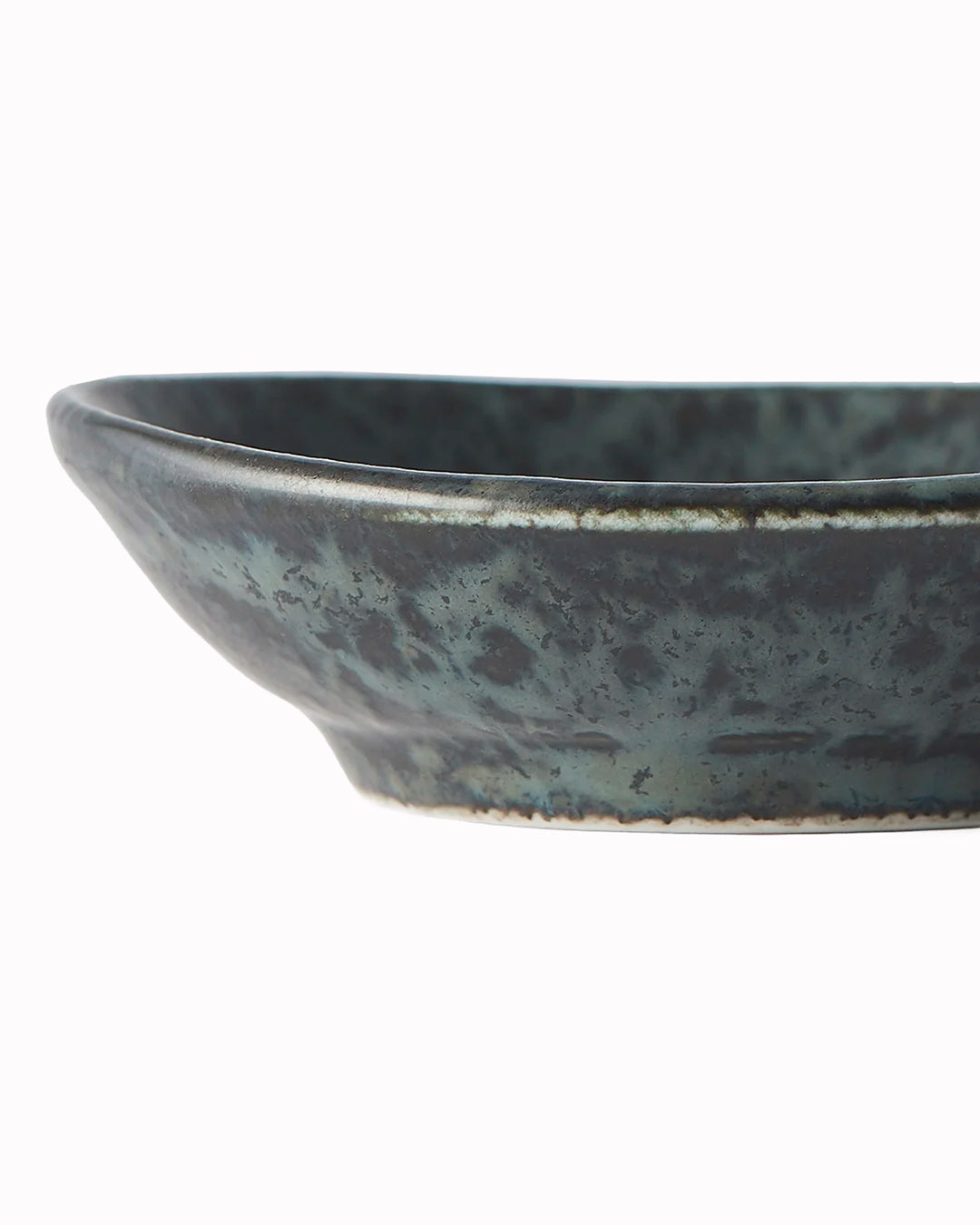 Made in Japan's BB Black porcelain collection features a mottled black glaze with iridescent blue highlights.