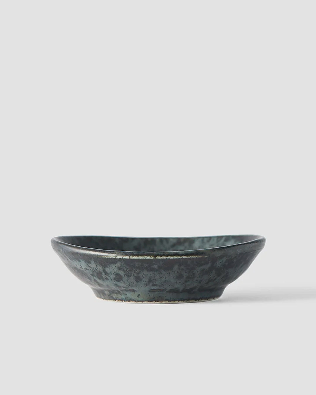 Made in Japan's BB Black porcelain collection features a mottled black glaze with iridescent blue highlights.
