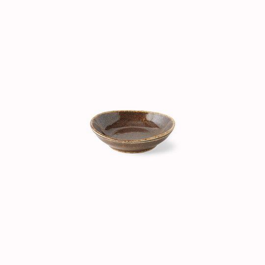 The Mocha Glaze features a a speckled glaze with dark chocolate tones. Each piece has a unique dappled pattern determined by its position in the kiln during the firing process.