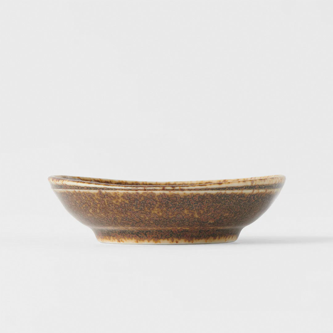 The Mocha Glaze features a a speckled glaze with dark chocolate tones. Each piece has a unique dappled pattern determined by its position in the kiln during the firing process.