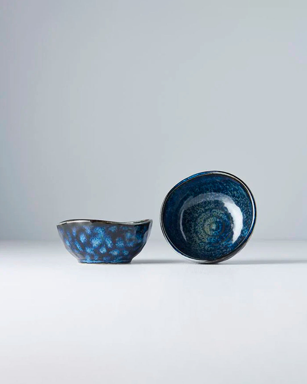 Inigo Blue Glaze Table Sauce Dish from Made in Japan, approximately 8.5cm with an irregular, organic shaping to the edge. Designed for soy sauce, dips or small condiments such as picked ginger.