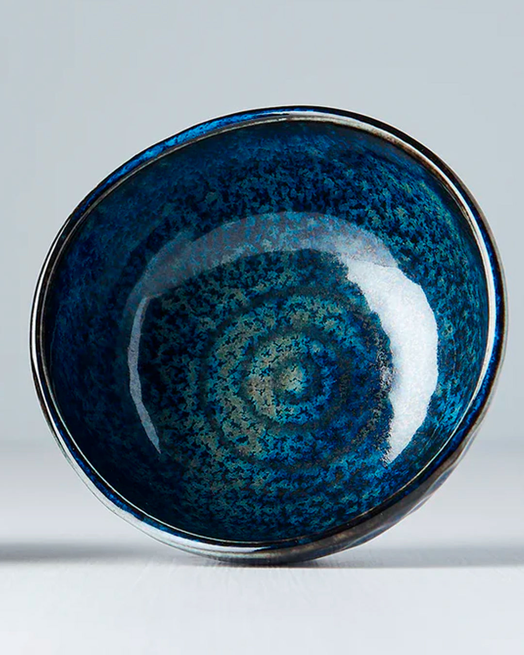Inigo Blue Glaze Table Sauce Dish from Made in Japan, approximately 8.5cm with an irregular, organic shaping to the edge. Designed for soy sauce, dips or small condiments such as picked ginger.