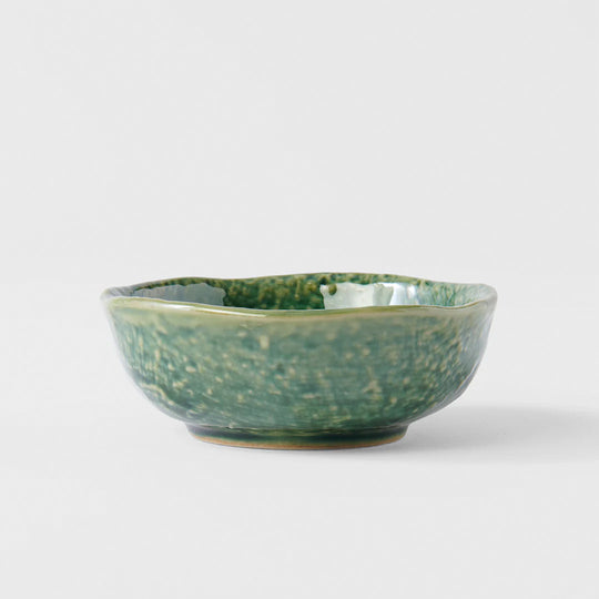 The Oribe Green Glaze features a mottled green with a yellow underglaze. Each piece has a unique dappled pattern determined by its position in the kiln during the firing process.