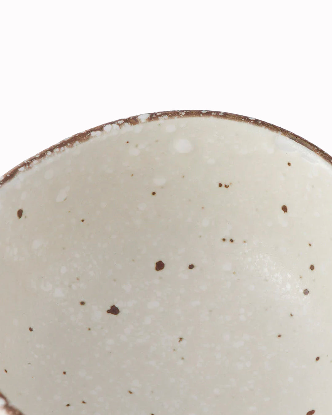 White Flecked Glaze Table Sauce Dish from Made in Japan, approximately 8.5cm with an irregular, organic shaping to the edge. Designed for soy sauce, dips or small condiments such as picked ginger.