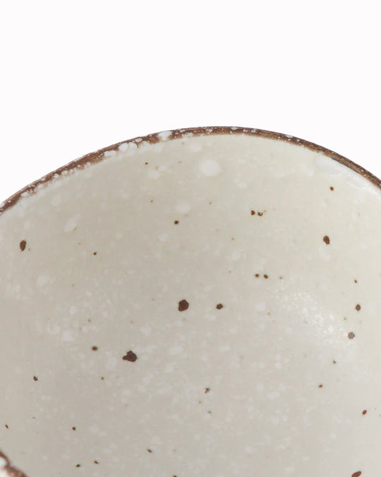 White Flecked Glaze Table Sauce Dish from Made in Japan, approximately 8.5cm with an irregular, organic shaping to the edge. Designed for soy sauce, dips or small condiments such as picked ginger.