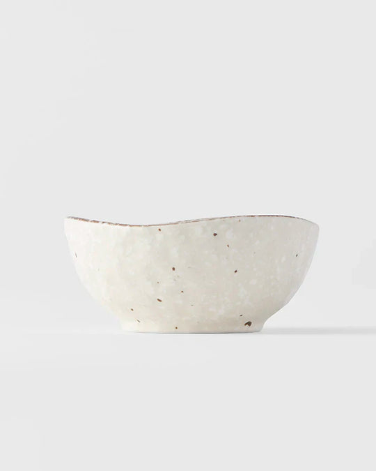White Flecked Glaze Table Sauce Dish from Made in Japan, approximately 8.5cm with an irregular, organic shaping to the edge. Designed for soy sauce, dips or small condiments such as picked ginger.