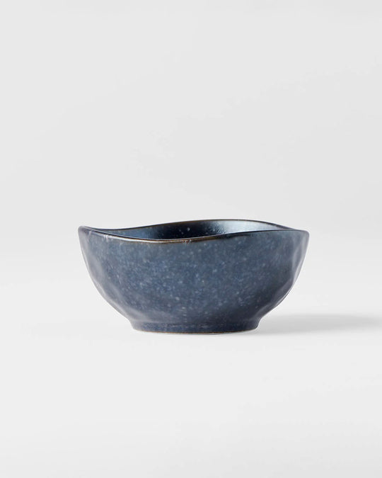 Matt Black Glaze Table Sauce Dish from Made in Japan, approximately 8.5cm with an irregular, organic shaping to the edge. Designed for soy sauce, dips or small condiments such as picked ginger.