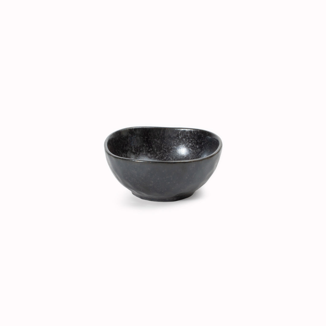 Matt Black Glaze Table Sauce Dish from Made in Japan, approximately 8.5cm with an irregular, organic shaping to the edge. Designed for soy sauce, dips or small condiments such as picked ginger.