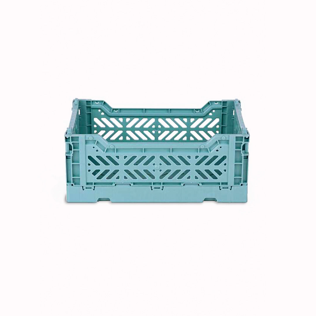 Teal Mini Folding Crate from Aykasa. This crate is made from 100% recyclable material and can be folded flat when not in use. It's perfect for holding books, toys, clothes, or anything else you want to organise. 