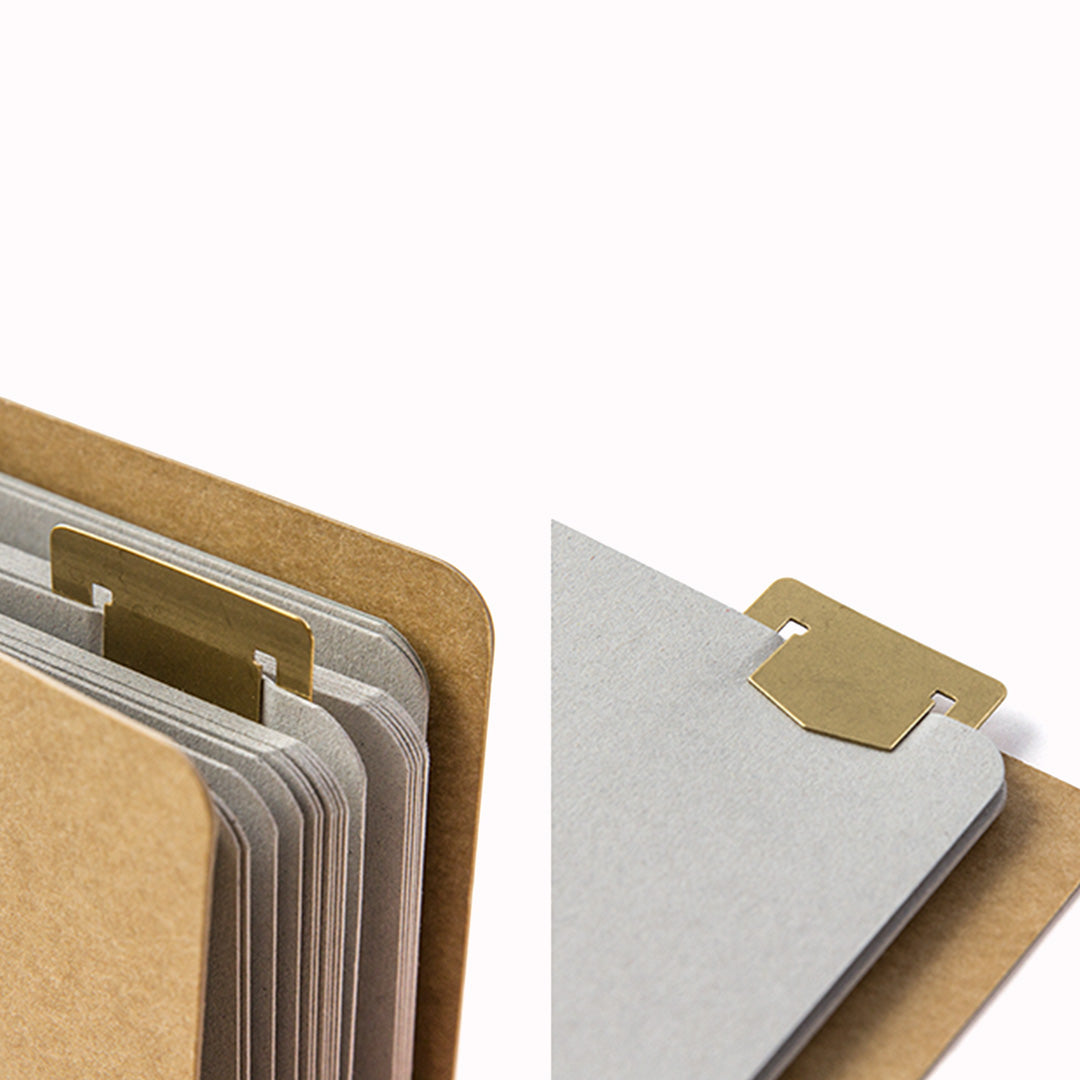 Made from solid brass with a tactile weight and finish, this piece works as both a bookmark and an alphabet template you can slot into your notebook or planner.