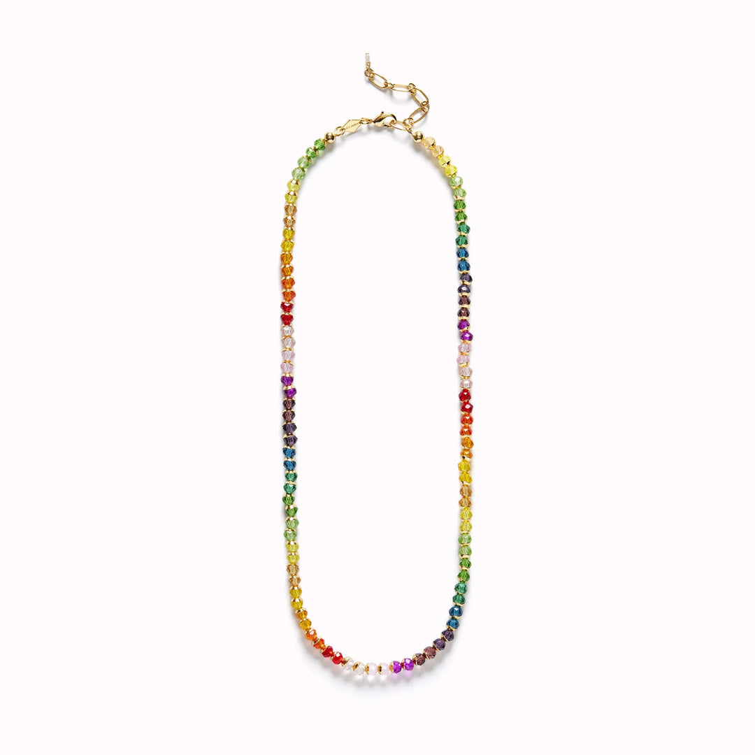 The Anni Lu 'Tennis Kinda' necklace is a playful and elegant piece of jewellery that captures the essence of fun with its multicoloured glass beads and 18-karat gold plating.