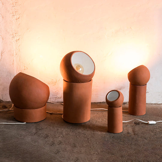 Terracotta Lamp designed by Lauren Van Driessche is her first collaboration with Serax, and was originally designed as a gift for her partner. Each item in the collection features an adjustable sphere that rests atop an empty cylinder, allowing you to easily direct the light wherever and whenever you wish.