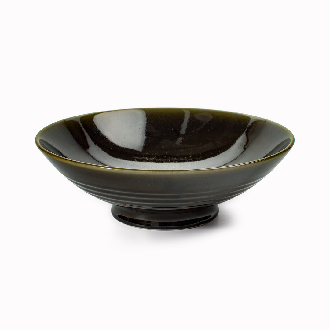 A stunning Japanese Mino ware Ramen bowl featuring a glossy dark green glaze with speckled cream feature glaze in the centre of the bowl.