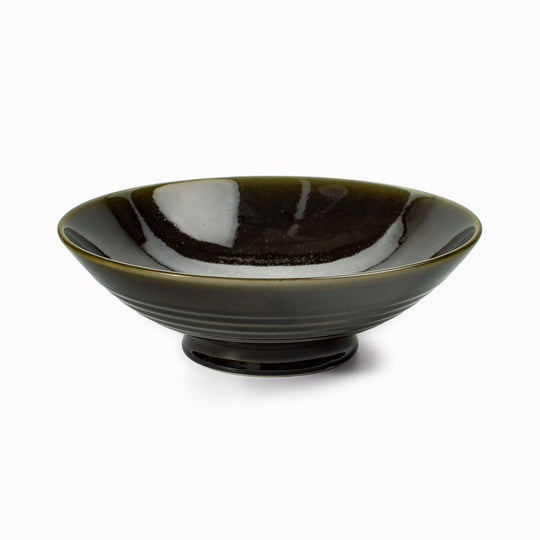 A stunning Japanese Mino ware Ramen bowl featuring a glossy dark green glaze with speckled cream feature glaze in the centre of the bowl.